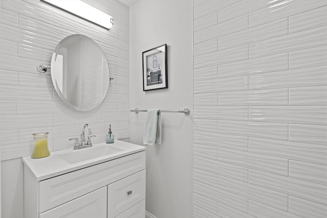 bathroom featuring decorative backsplash and vanity