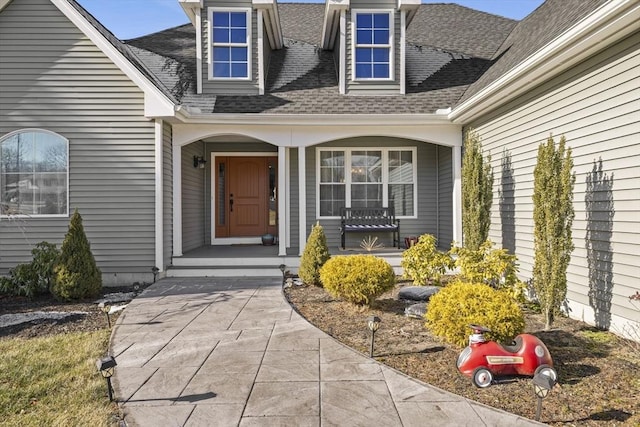 entrance to property featuring covered porch