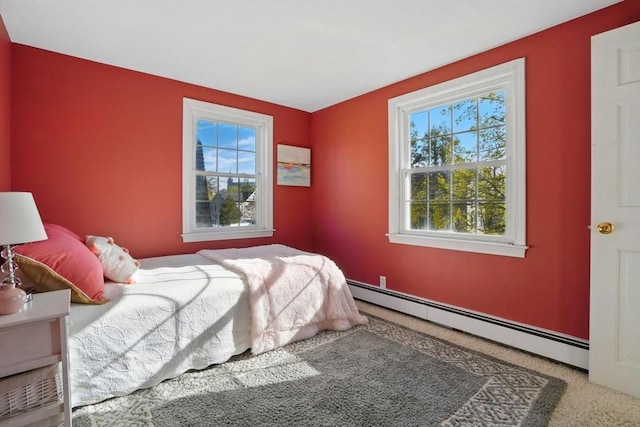 bedroom featuring carpet floors and a baseboard radiator
