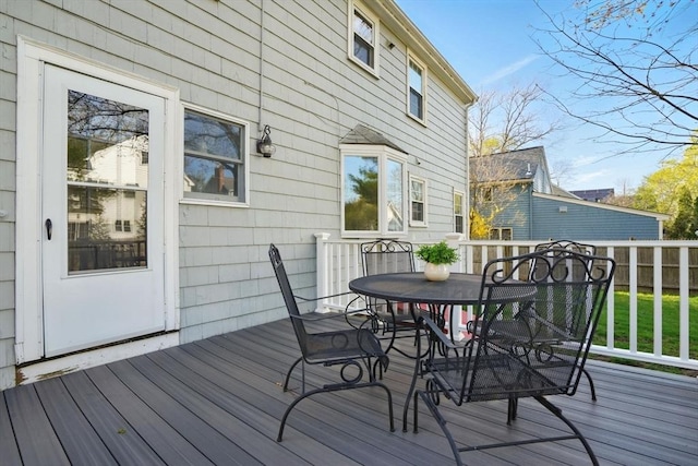 deck featuring fence and outdoor dining area