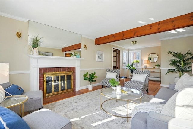 living area featuring crown molding, a brick fireplace, wood finished floors, baseboards, and baseboard heating