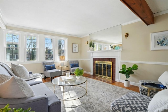 living room with baseboards, wood finished floors, and a healthy amount of sunlight