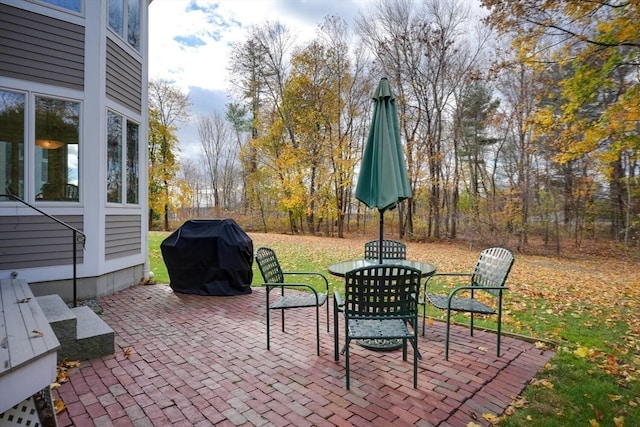 view of patio featuring a grill