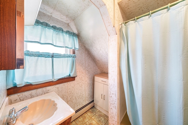 bathroom featuring vanity, a shower with shower curtain, lofted ceiling, and a baseboard heating unit