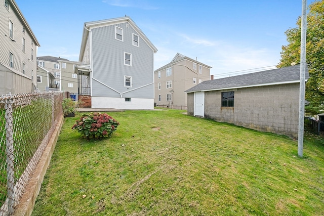 back of house featuring a yard