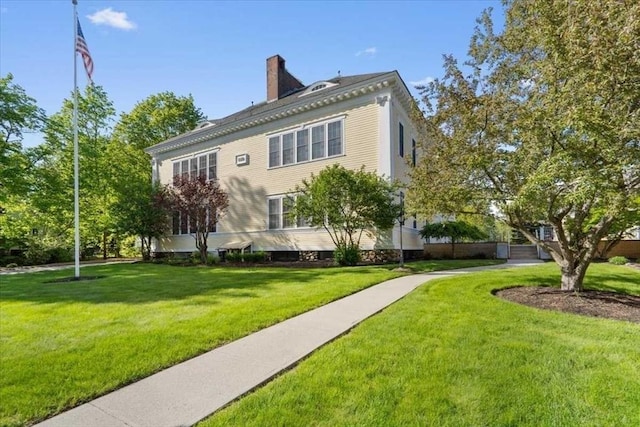 42 Phillips Rd Unit 1, Holden, MA 01520 - back of property featuring a chimney and a lawn