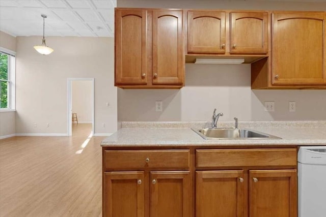 42 Phillips Rd Unit 1, Holden, MA 01520 - kitchen featuring dishwasher, a sink, light countertops, and hanging light fixtures