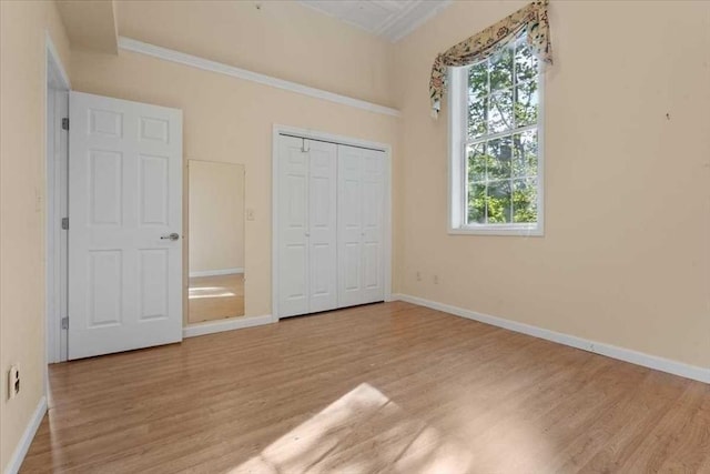 42 Phillips Rd Unit 1, Holden, MA 01520 - unfurnished bedroom featuring wood finished floors, multiple windows, and baseboards