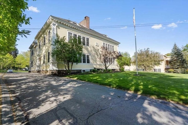 42 Phillips Rd Unit 1, Holden, MA 01520 - view of property exterior with a lawn and a chimney