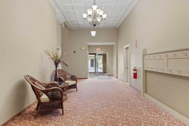 42 Phillips Rd Unit 1, Holden, MA 01520 - hallway featuring a chandelier and carpet floors