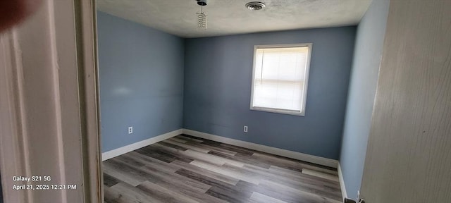 50 Clark St Unit 12, Fall River, MA 02720 - spare room featuring baseboards, visible vents, and wood finished floors