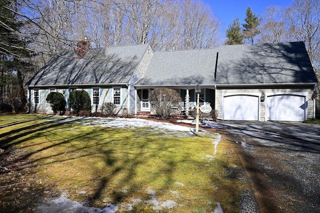 cape cod home with driveway, a garage, a chimney, roof with shingles, and a front lawn