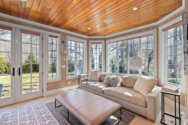 sunroom featuring wooden ceiling and french doors