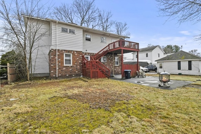 10 Gleason Rd, Shrewsbury, MA 01545 - rear view of house with brick siding, stairway, a yard, a deck, and a patio area