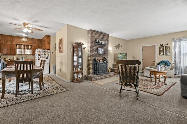 10 Gleason Rd, Shrewsbury, MA 01545 - carpeted living room featuring ceiling fan and a wood stove