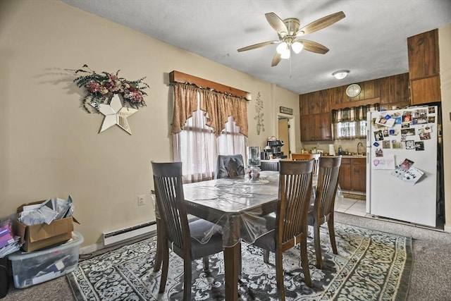 10 Gleason Rd, Shrewsbury, MA 01545 - dining area with ceiling fan, light colored carpet, and a baseboard radiator