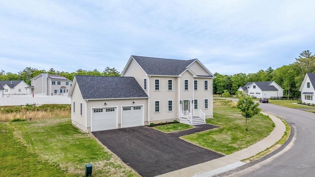 13 Nantucket Dr, Mattapoisett, MA 02719 - view of front of property with a garage, driveway, a front yard, and a residential view