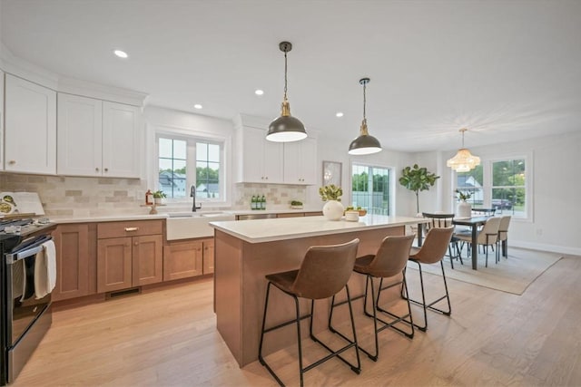 13 Nantucket Dr, Mattapoisett, MA 02719 - kitchen featuring a sink, stainless steel range oven, healthy amount of natural light, and recessed lighting