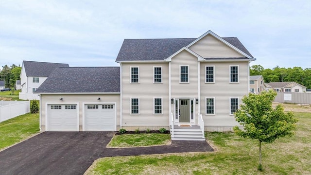 13 Nantucket Dr, Mattapoisett, MA 02719 - colonial inspired home featuring an attached garage, driveway, and roof with shingles