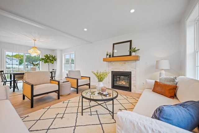 13 Nantucket Dr, Mattapoisett, MA 02719 - living room with light wood finished floors, a fireplace, a chandelier, recessed lighting, and baseboards