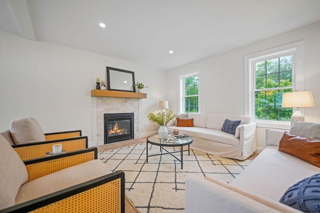 13 Nantucket Dr, Mattapoisett, MA 02719 - living room with wood finished floors, a tiled fireplace, baseboards, and recessed lighting