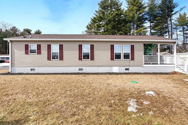 exterior space with a lawn, roof with shingles, and crawl space