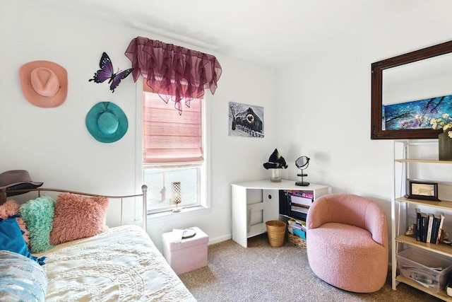 carpeted bedroom with baseboards