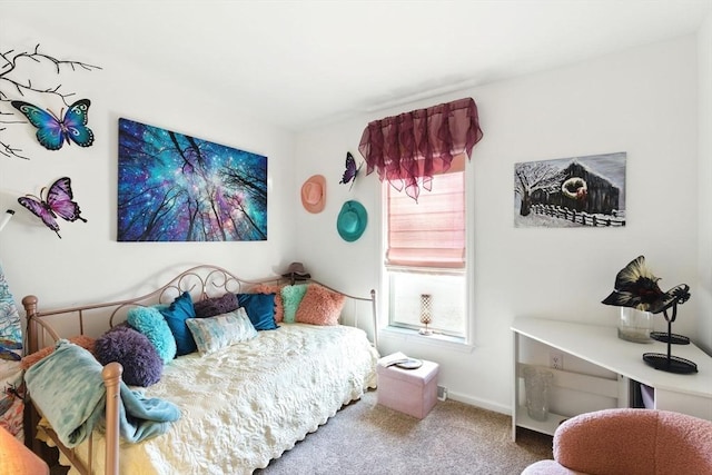 bedroom featuring carpet flooring and baseboards