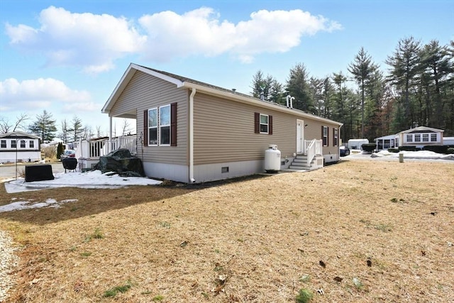 view of side of property featuring crawl space