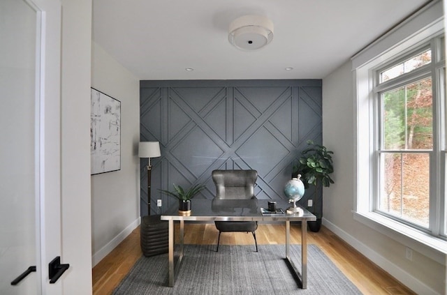 office space featuring a healthy amount of sunlight and light wood-type flooring