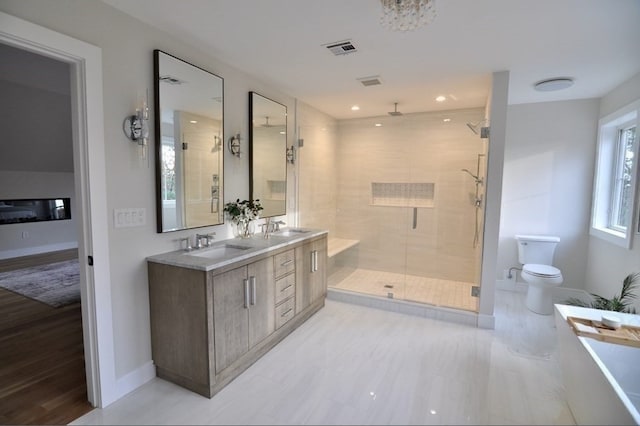 full bathroom with vanity, toilet, wood-type flooring, and independent shower and bath