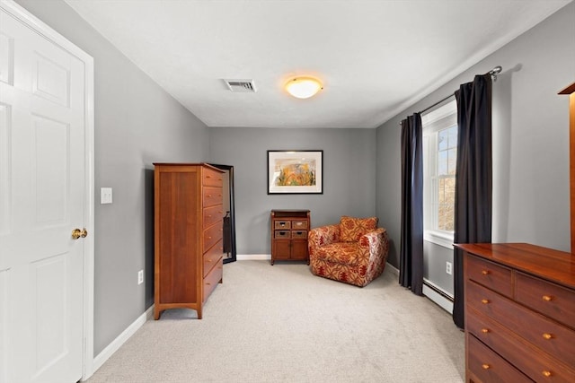 living area with a baseboard radiator and light carpet