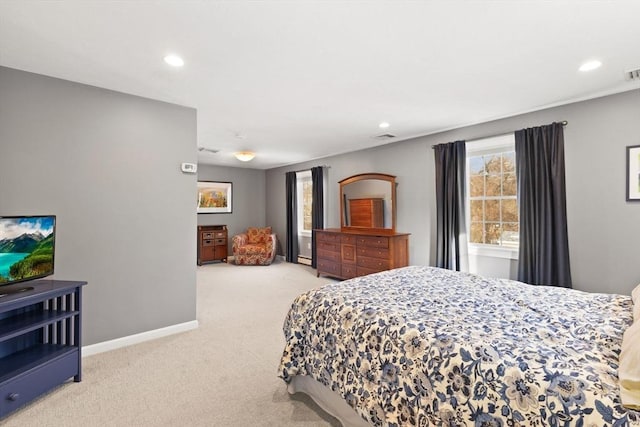 bedroom featuring light carpet