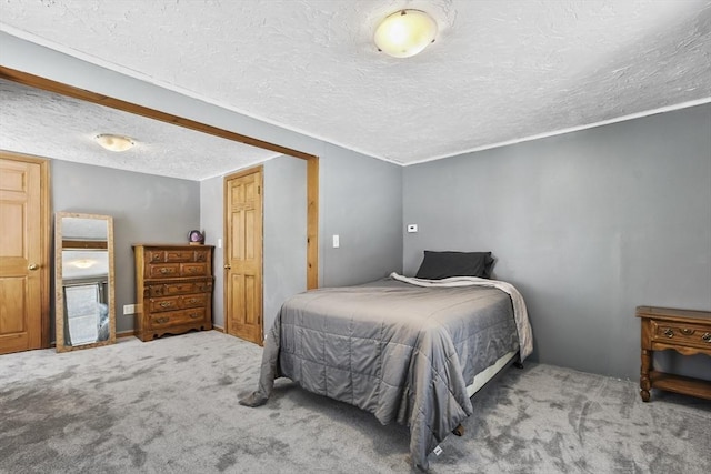 carpeted bedroom with a textured ceiling