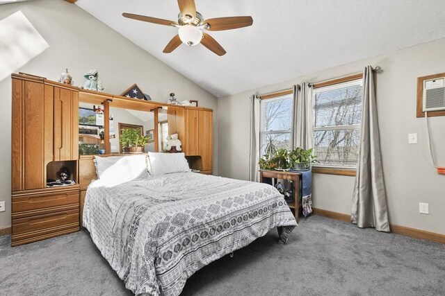 carpeted bedroom featuring baseboards, ceiling fan, and vaulted ceiling