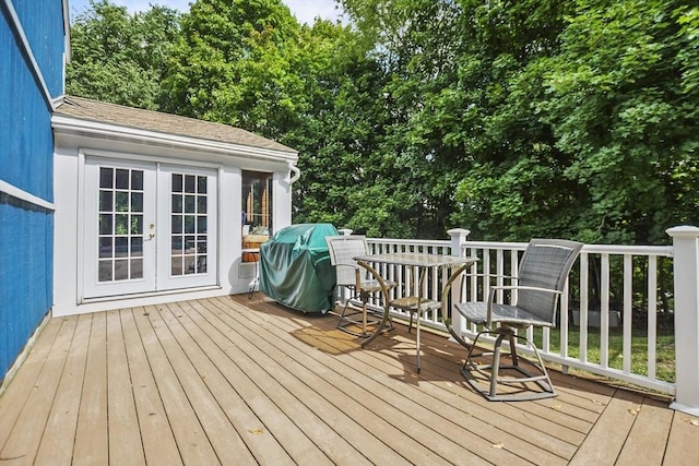 deck with french doors and a grill