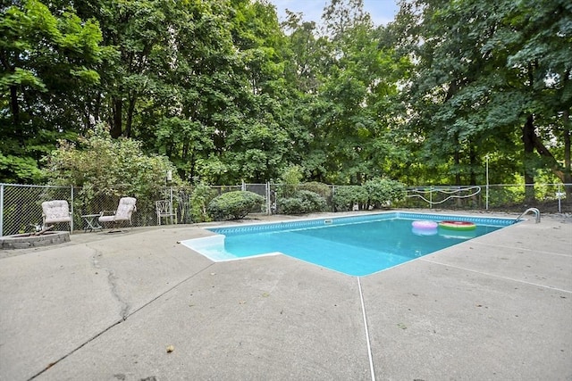 view of pool featuring a patio, fence, and a fenced in pool