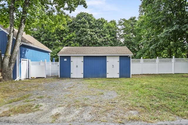 view of shed with fence