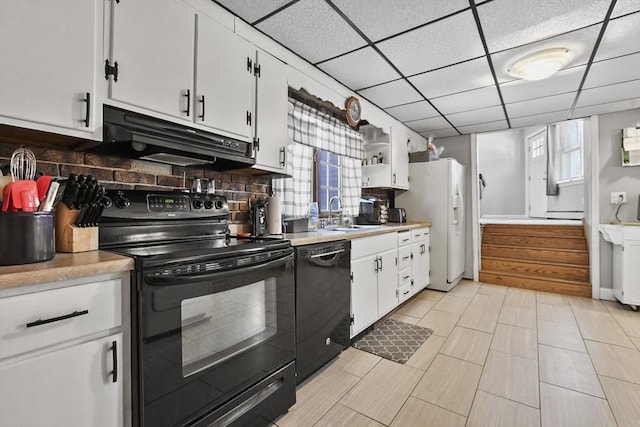 kitchen with black appliances, under cabinet range hood, a sink, tasteful backsplash, and light countertops