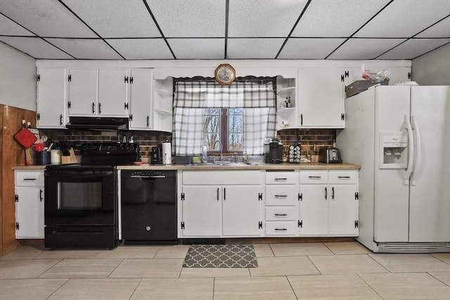 kitchen featuring open shelves, a sink, black appliances, under cabinet range hood, and white cabinetry