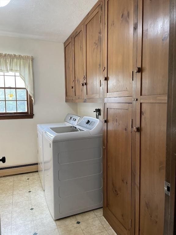 33 Whittemore St, Leicester, MA 01524 - washroom featuring cabinet space, baseboard heating, washer and dryer, and light tile patterned flooring