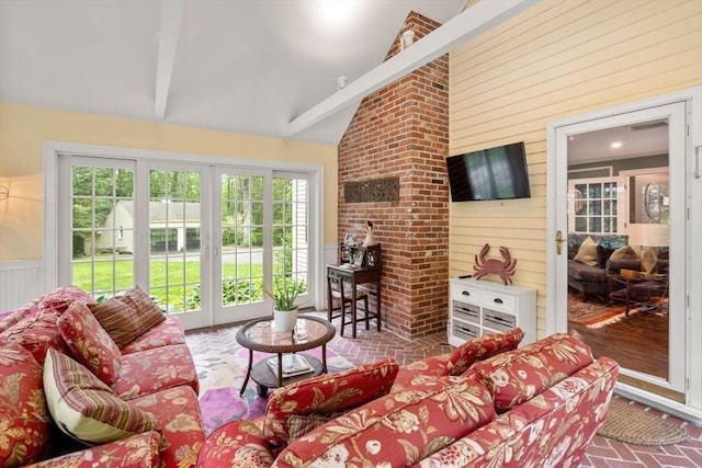 153 Old Connecticut Path, Wayland, MA 01778 - living area featuring wooden walls, brick floors, beam ceiling, and high vaulted ceiling