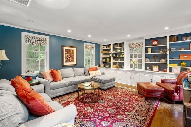 153 Old Connecticut Path, Wayland, MA 01778 - living room with crown molding, recessed lighting, wood finished floors, and built in shelves