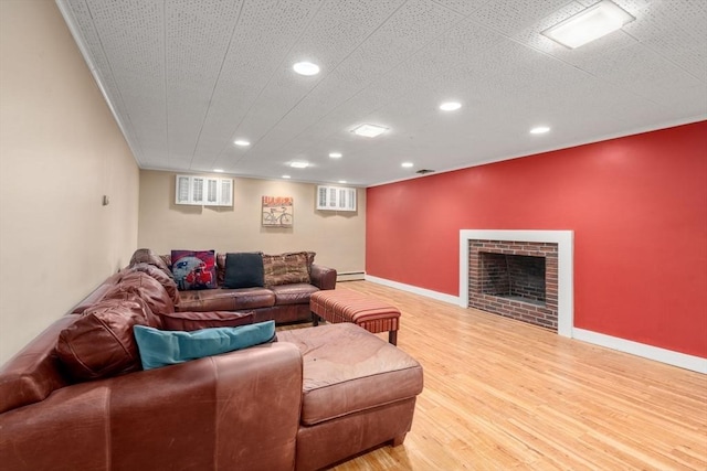 153 Old Connecticut Path, Wayland, MA 01778 - living room with recessed lighting, light wood-style flooring, a fireplace, crown molding, and a baseboard radiator