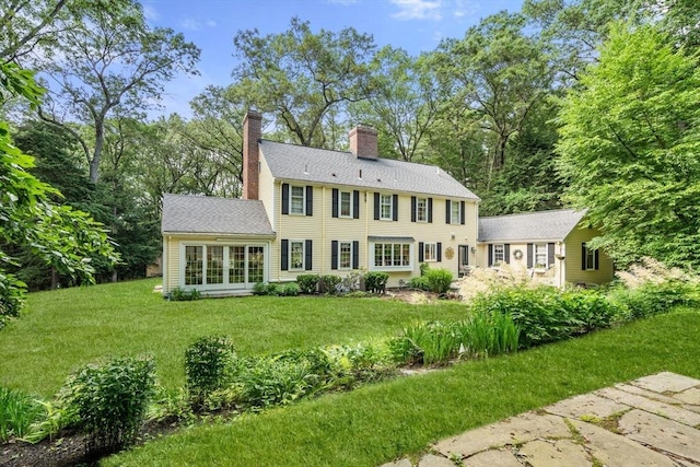 153 Old Connecticut Path, Wayland, MA 01778 - back of property with a lawn and a chimney