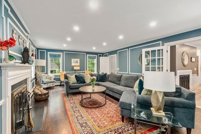 153 Old Connecticut Path, Wayland, MA 01778 - living area with a decorative wall, a fireplace, ornamental molding, wood finished floors, and recessed lighting