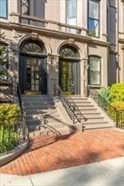 entrance to property with a balcony