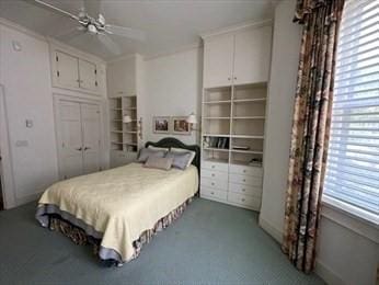 bedroom with a closet and a ceiling fan