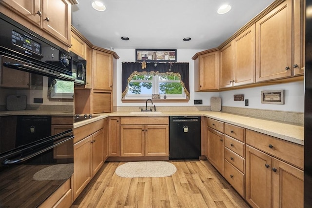 148 Walnut Hill Rd, Orange, MA 01364 - kitchen with black appliances, light wood finished floors, light countertops, recessed lighting, and brown cabinets