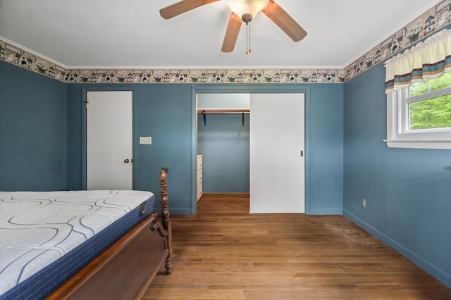 148 Walnut Hill Rd, Orange, MA 01364 - bedroom featuring wood-type flooring, a closet, ornamental molding, and a ceiling fan